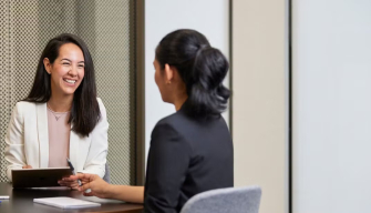 A warm counsellor sits with a client illustrating the journey of becoming a counsellor in Australia
