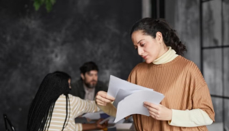 A compassionate social worker consults with a client, representing the diverse types of social work careers available.
