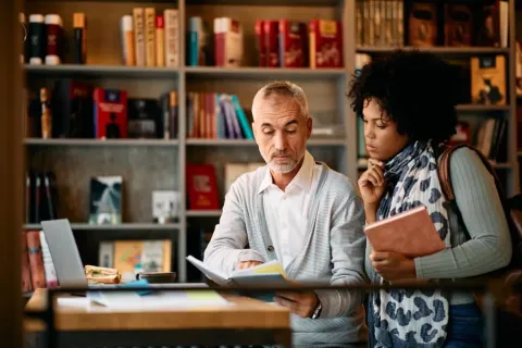 Two professionals engage in active learning strategies for career and professional development