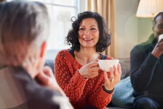 A counsellor smiles warmly during a session, reflecting the rewarding salaries and career of counselling in Australia.