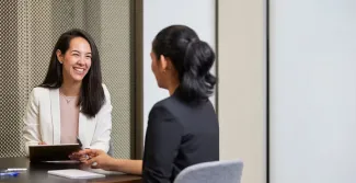 A warm counsellor sits with a client illustrating the journey of becoming a counsellor in Australia